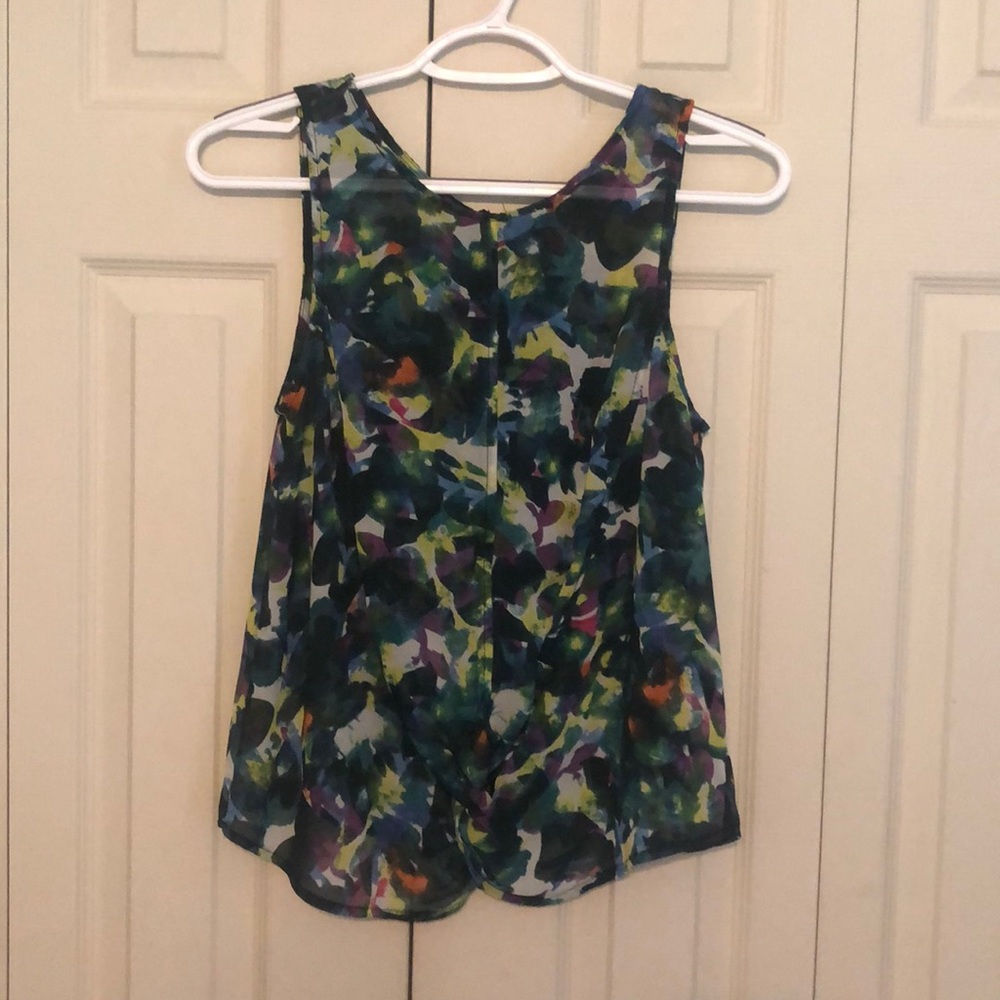 Woman’s knotted, Sheer, Sleeveless Top
